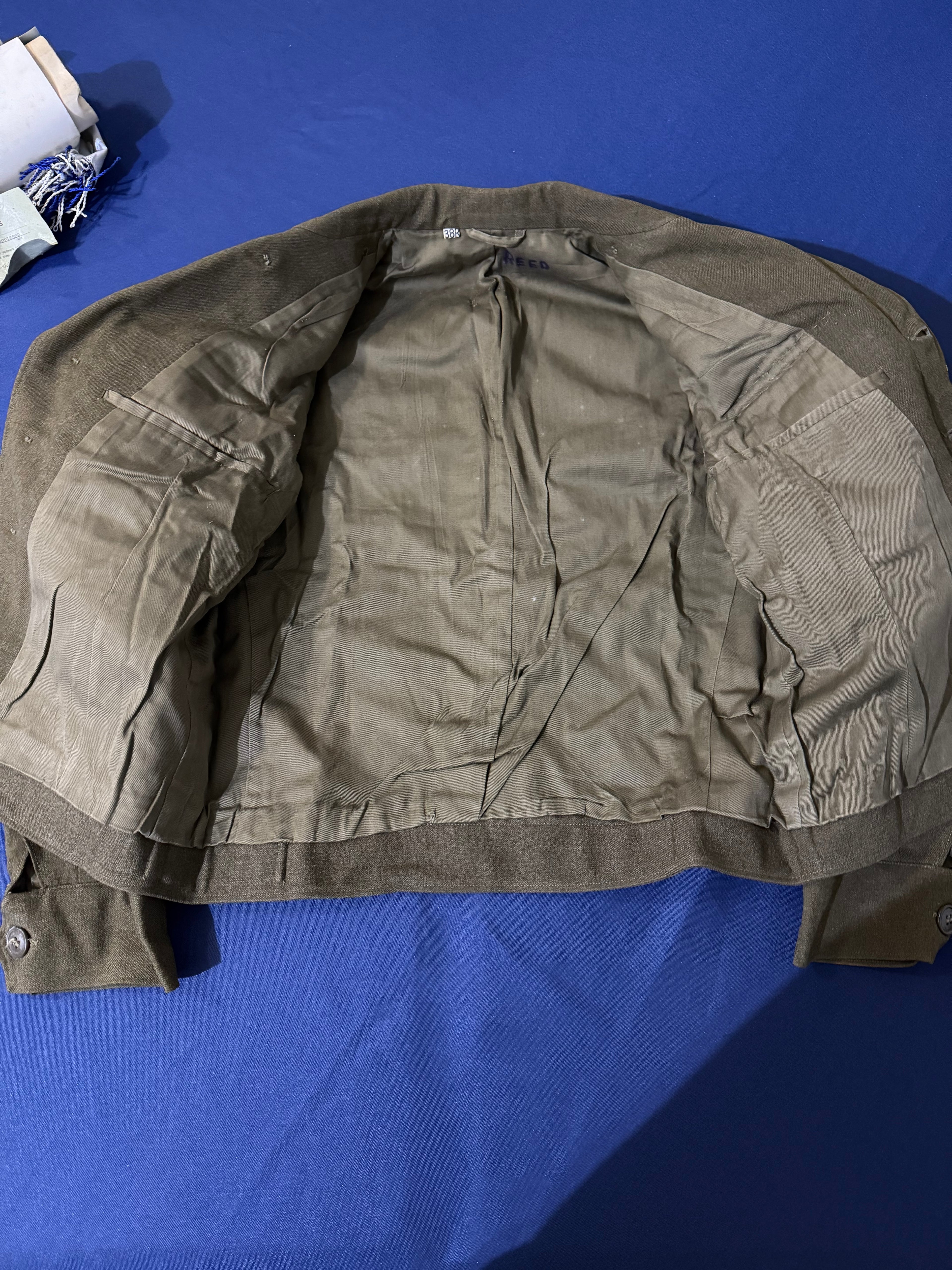 Original WWII U.S. Army uniform grouping attributed to John Reed, who served with the 16th Armored Field Artillery Battalion of the 9th Armored Division and later associated with the 102nd Infantry Division, known as the “Ozark” Division.