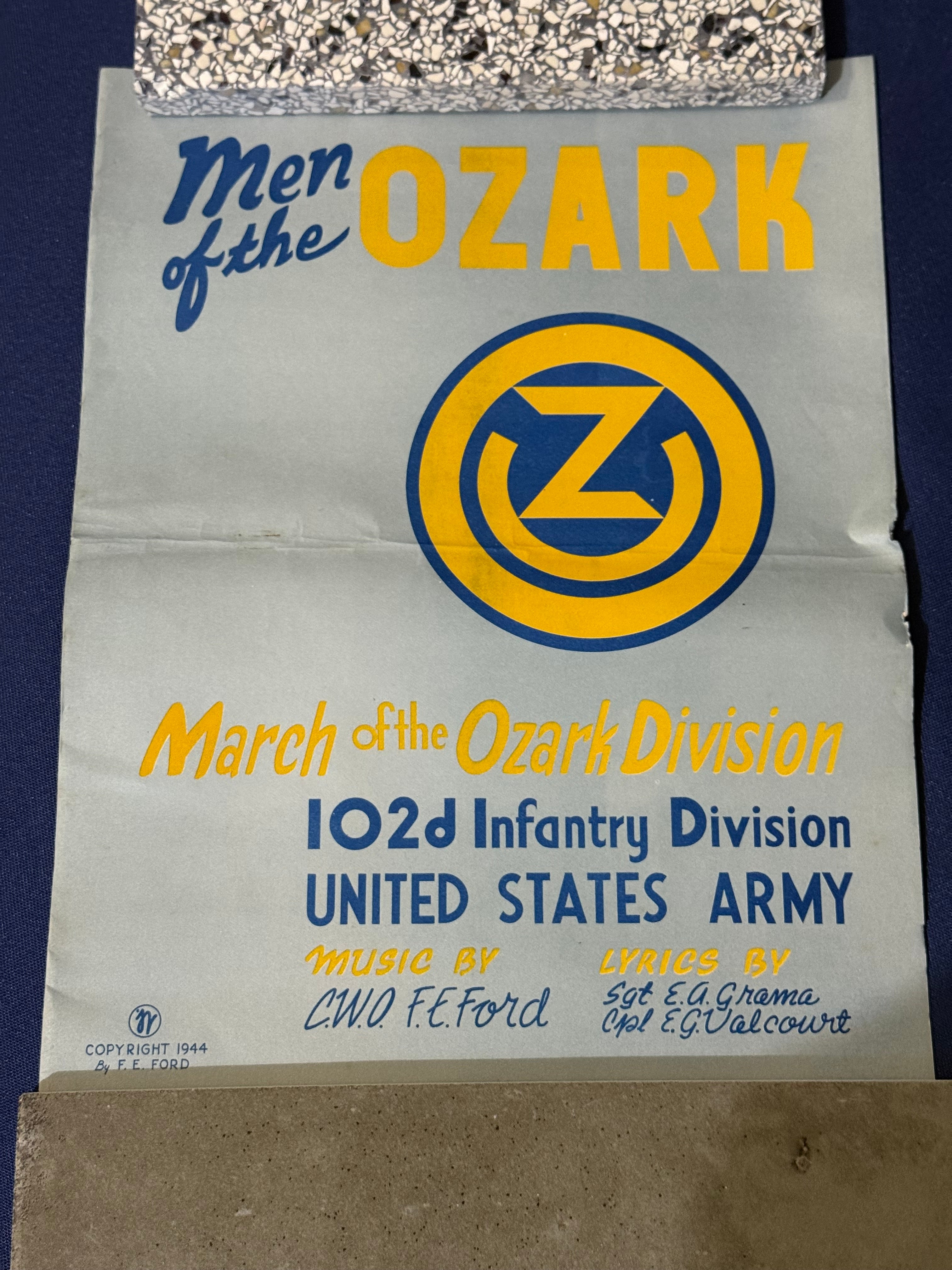 Original WWII U.S. Army uniform grouping attributed to John Reed, who served with the 16th Armored Field Artillery Battalion of the 9th Armored Division and later associated with the 102nd Infantry Division, known as the “Ozark” Division.