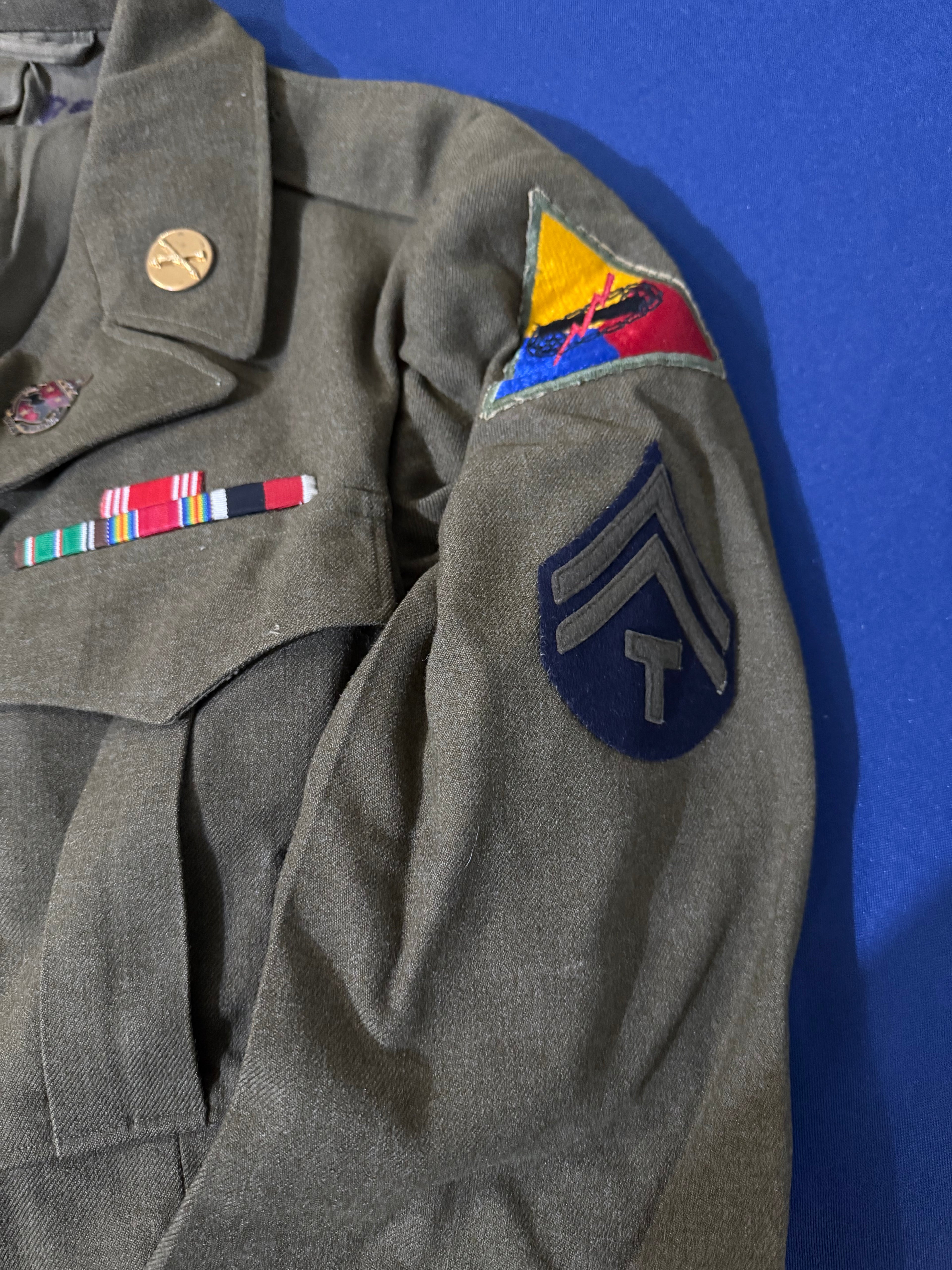 Original WWII U.S. Army uniform grouping attributed to John Reed, who served with the 16th Armored Field Artillery Battalion of the 9th Armored Division and later associated with the 102nd Infantry Division, known as the “Ozark” Division.