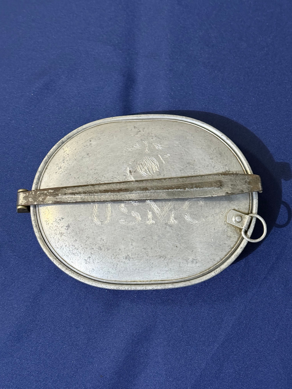 Original World War I-era U.S. mess kit, complete with its matching fork and knife. USMC and EGA on lid.