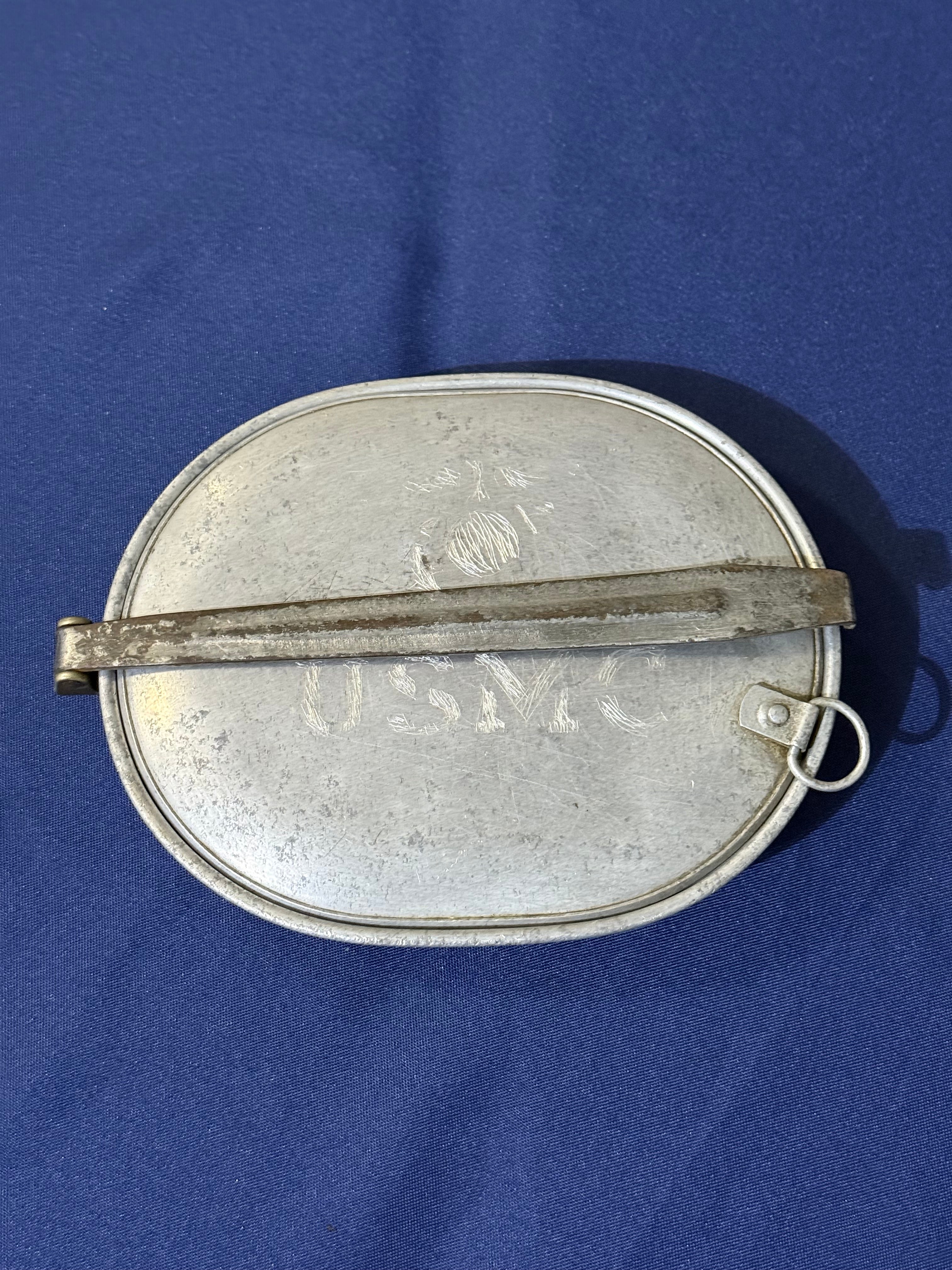 Original World War I-era U.S. mess kit, complete with its matching fork and knife. USMC and EGA on lid.