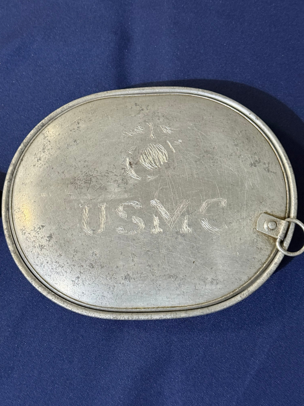 Original World War I-era U.S. mess kit, complete with its matching fork and knife. USMC and EGA on lid.