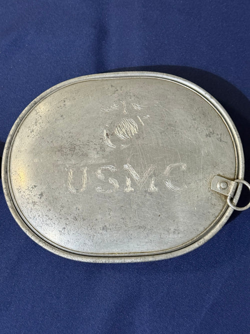 Original World War I-era U.S. mess kit, complete with its matching fork and knife. USMC and EGA on lid.