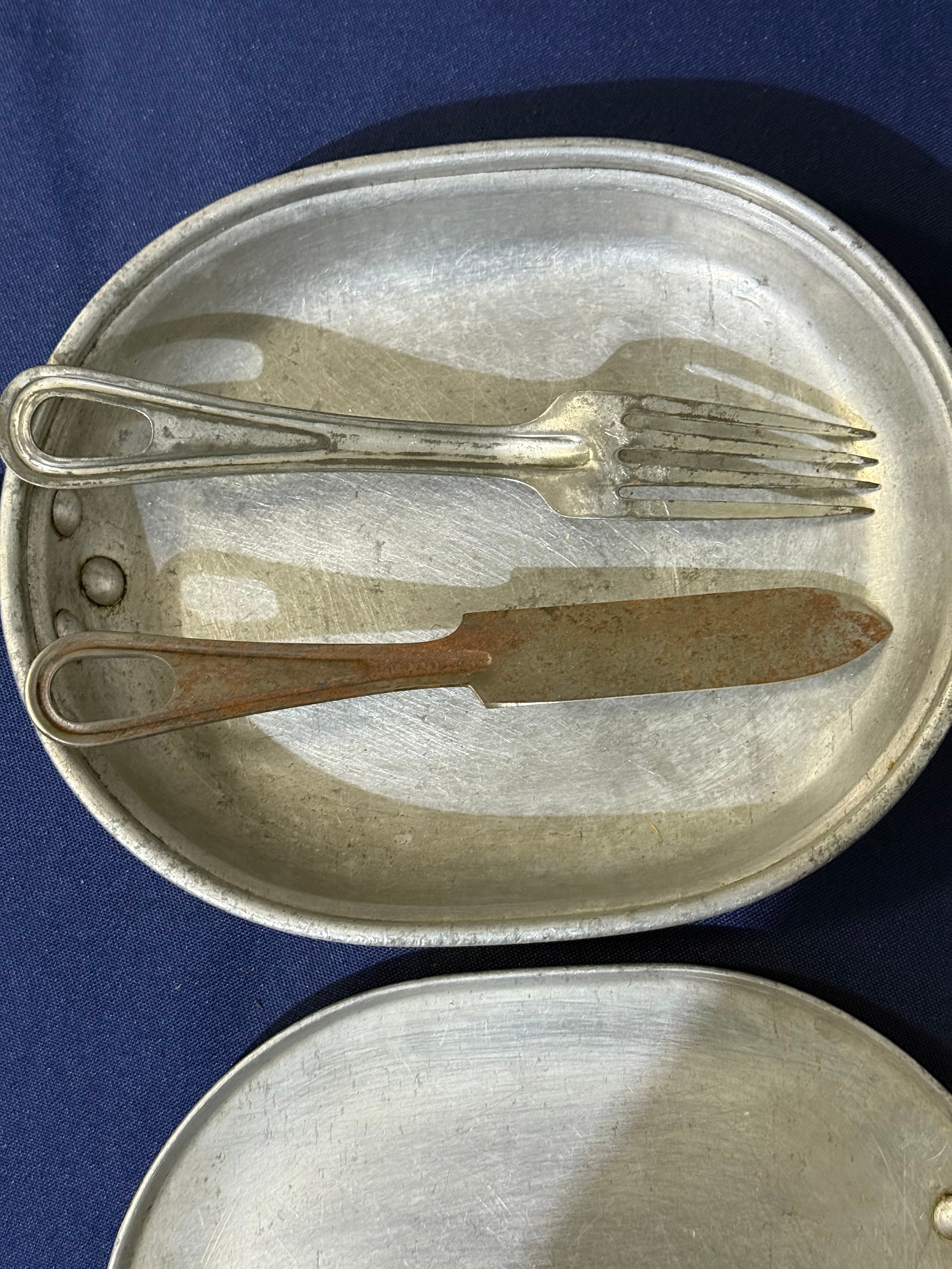 Original World War I-era U.S. mess kit, complete with its matching fork and knife. USMC and EGA on lid.